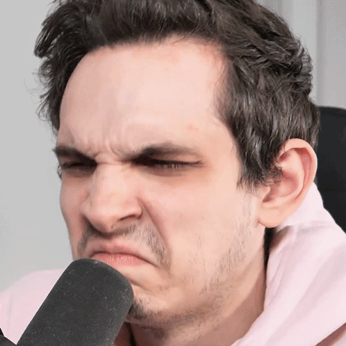 A Man With A Beard Is Making A Funny Face GIF