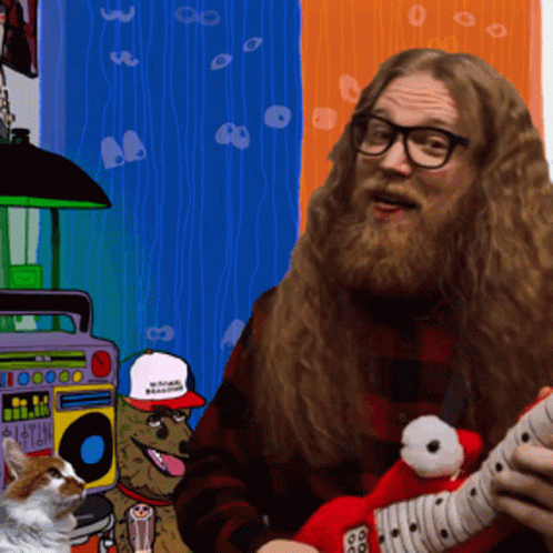 A Man With A Beard Is Playing A Guitar In Front Of A Boombox That Says I Love You GIF