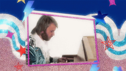A Man With A Beard Is Playing A Piano In A Frame GIF