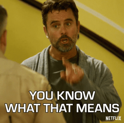 A Man With A Beard Is Pointing At Another Man And Says You Know What That Means GIF