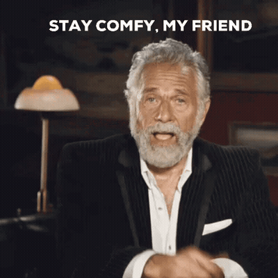 A Man With A Beard Is Pointing At The Camera With The Words Stay Comfy My Friend Behind Him GIF