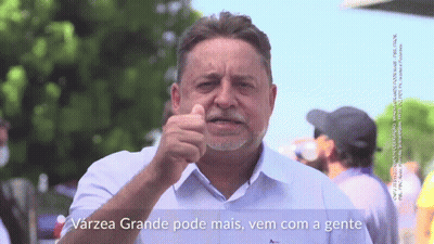 A Man With A Beard Is Pointing At The Camera With The Words Varzea Grande Pode Mais Vem Com A Gente Below Him GIF
