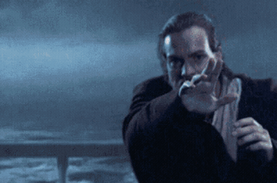 A Man With A Beard Is Pointing His Finger At Something GIF