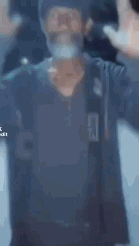 A Man With A Beard Is Praying With The Word Expansion In The Corner GIF