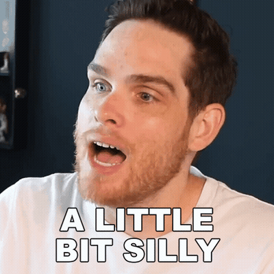 A Man With A Beard Is Saying A Little Bit Silly With His Mouth Open GIF