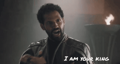 A Man With A Beard Is Saying " I Am Your King " In Front Of A Fire GIF
