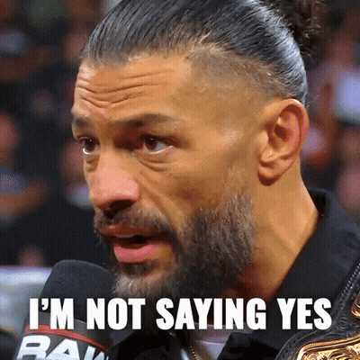 A Man With A Beard Is Saying I 'M Not Saying Yes In Front Of A Microphone GIF