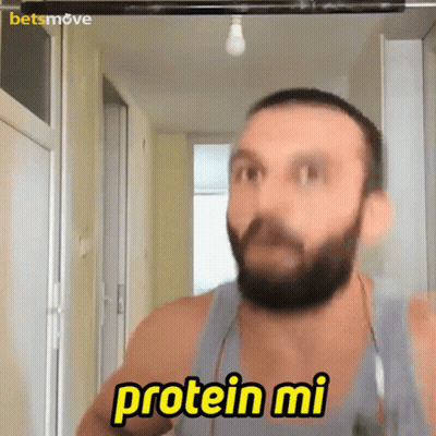 A Man With A Beard Is Saying " Protein Mi " GIF