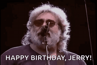 A Man With A Beard Is Singing Into A Microphone And Saying `` Happy Birthday Jerry '' . GIF