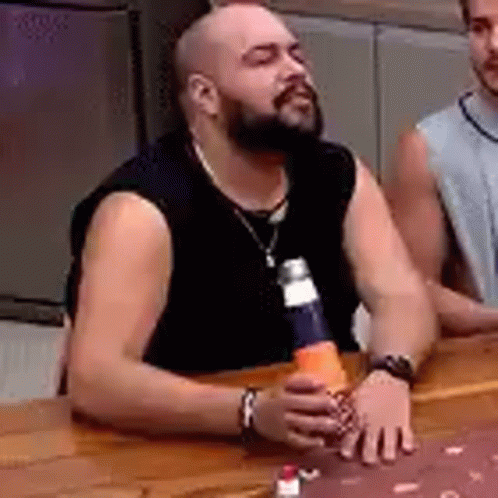 Man With Beard Holding Cone And Bottle GIF