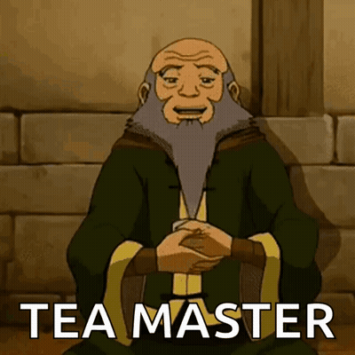 A Man With A Beard Is Sitting Down With His Hands Folded And The Words Tea Master Written On The Bottom GIF