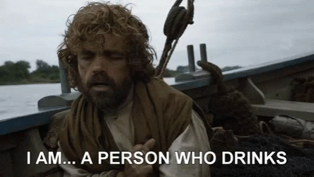 A Man With A Beard Is Sitting In A Boat And Saying `` I Am ... A Person Who Drinks '' GIF