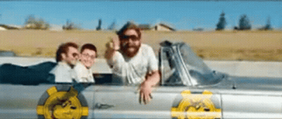 A Man With A Beard Is Sitting In A Car With Two Other Men . GIF