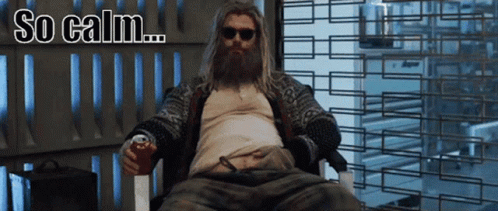 A Man With A Beard Is Sitting In A Chair With A Can Of Soda In His Hand And The Words So Calm Below Him GIF