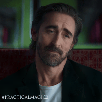 A Man With A Beard Is Sitting In A Chair With The Hashtag #Practicalmagic2 GIF