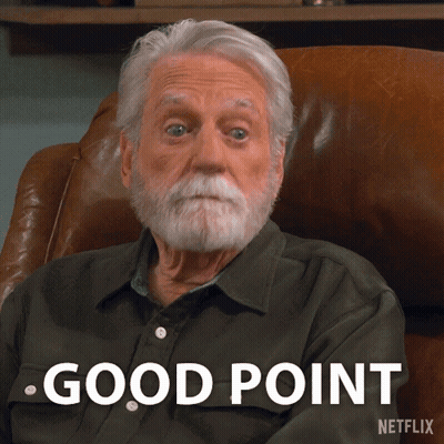 A Man With A Beard Is Sitting In A Chair With The Words Good Point Written On The Bottom GIF