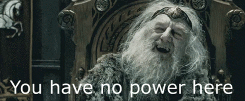 A Man With A Beard Is Sitting In A Chair With The Words " You Have No Power Here " Above Him GIF