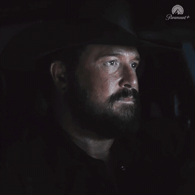 A Man With A Beard Is Sitting In A Dark Room With The Word Nope On The Bottom GIF