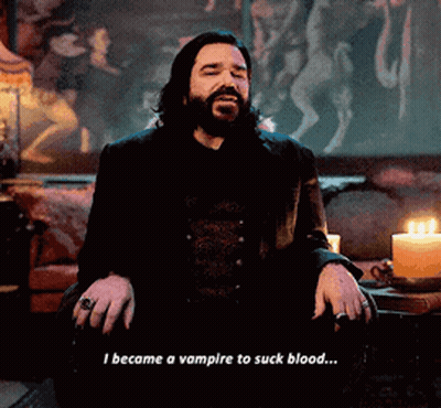 A Man With A Beard Is Sitting In Front Of A Candle And Says I Became A Vampire To Suck Blood ... GIF