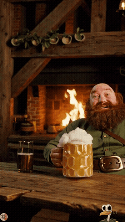 A Man With A Beard Is Sitting In Front Of A Fireplace Holding A Large Mug Of Beer GIF