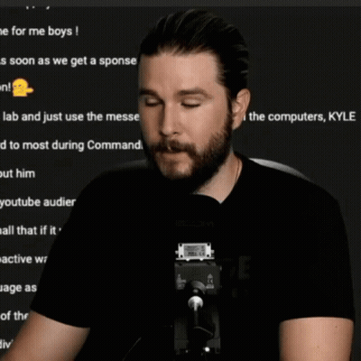 A Man With A Beard Is Sitting In Front Of A Microphone And The Words Pfft Are On The Screen GIF