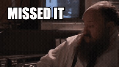A Man With A Beard Is Sitting In Front Of A Tv With The Words Missed It Above Him GIF
