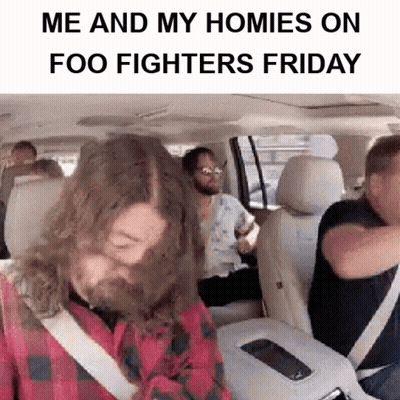 A Man With A Beard Is Sitting In The Back Seat Of A Car With Other People .. GIF