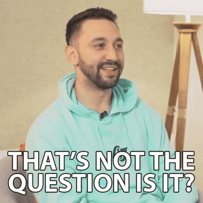 A Man With A Beard Is Sitting On A Couch And Says That 'S Not The Question Is It . GIF
