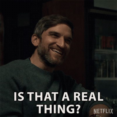 A Man With A Beard Is Smiling And Asking Is That A Real Thing GIF