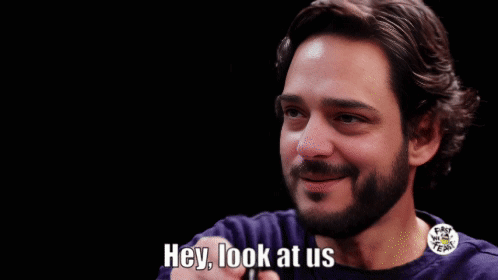 A Man With A Beard Is Smiling And Asking Who Would 'Ve Thought GIF