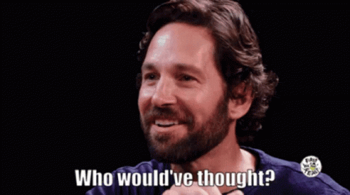 A Man With A Beard Is Smiling And Asking Who Would Ve Thought GIF