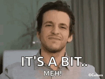 A Man With A Beard Is Smiling And Saying `` It 'S A Bit Meh ! '' GIF