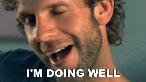 A Man With A Beard Is Smiling And Says I 'M Doing Well GIF