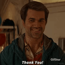 A Man With A Beard Is Smiling And Says Thank You . GIF