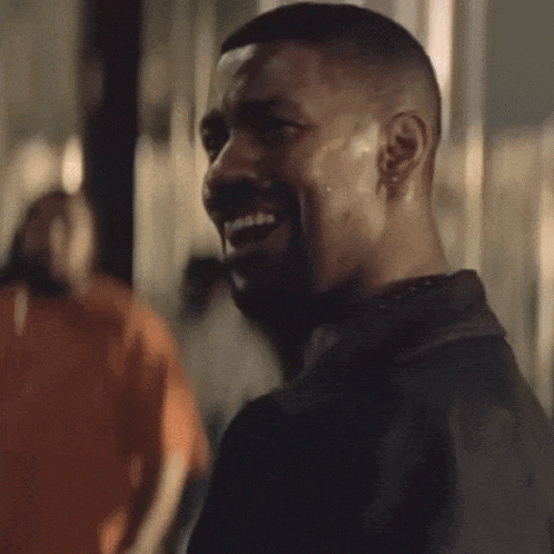 A Man With A Beard Is Smiling And The Word Ok Is On His Face GIF