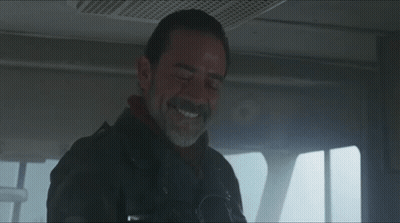 A Man With A Beard Is Smiling And Wearing A Jacket That Says ' Abercrombie & Fitch ' On It GIF