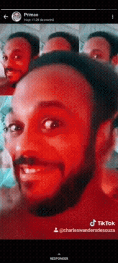 A Man With A Beard Is Smiling In A Tiktok Video . GIF