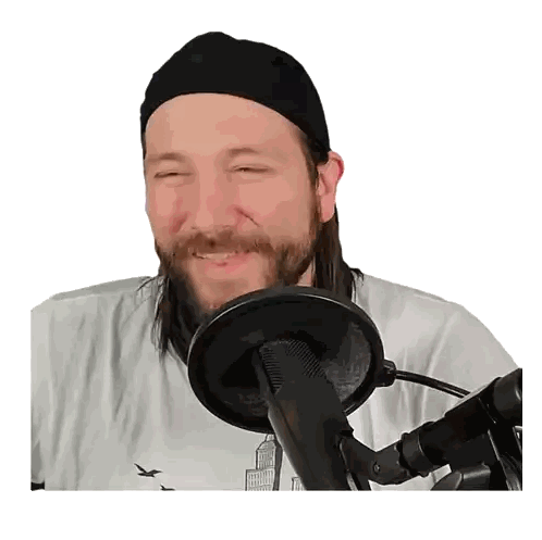 A Man With A Beard Is Smiling In Front Of A Microphone With His Eyes Closed Sticker
