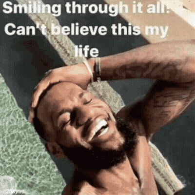 A Man With A Beard Is Smiling Through It All And Can 'T Believe This Is My Life . GIF