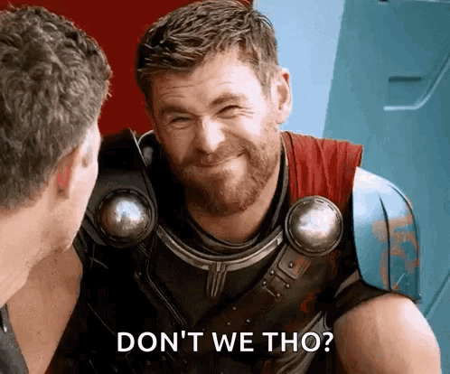 A Man With A Beard Is Smiling While Talking To Another Man And Says `` Do N't We Tho '' . GIF