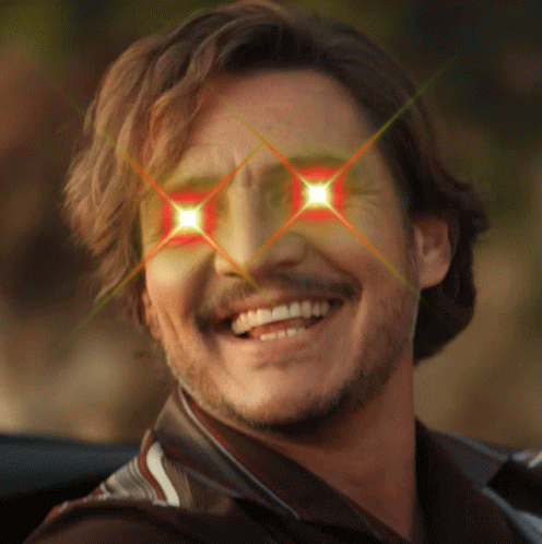 A Man With A Beard Is Smiling With Red Eyes GIF