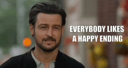A Man With A Beard Is Smiling With The Words Everybody Likes A Happy Ending Below Him GIF