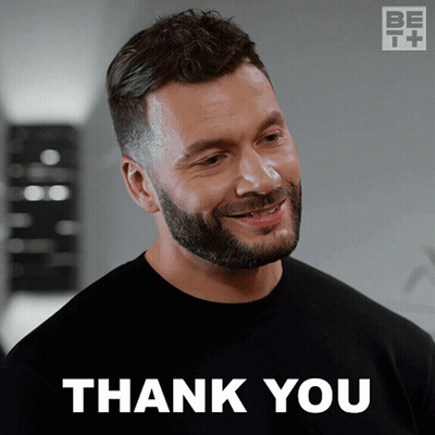 A Man With A Beard Is Smiling With The Words Thank You Behind Him GIF