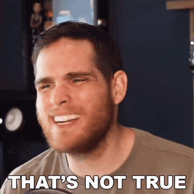 A Man With A Beard Is Smiling With The Words That 'S Not True Behind Him GIF