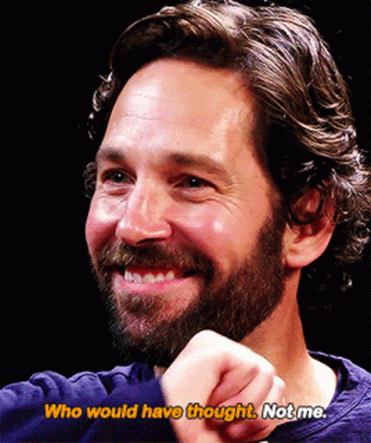 A Man With A Beard Is Smiling With The Words Who Would Have Thought Not Me Below Him GIF
