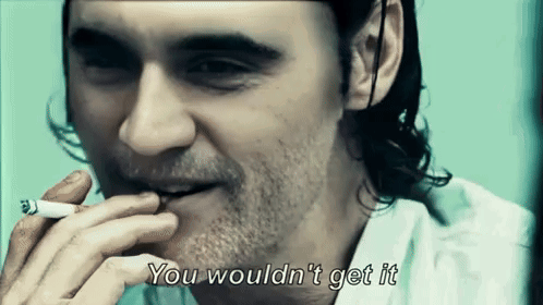 A Man With A Beard Is Smoking A Cigarette And Saying You Wouldn T Get It GIF