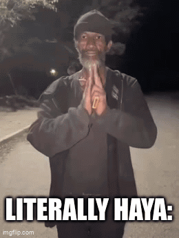 A Man With A Beard Is Smoking A Cigarette And The Caption Literally Haya GIF