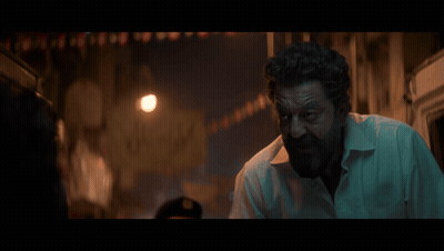 A Man With A Beard Is Standing In A Dark Alleyway With The Word Dard Written On The Bottom GIF
