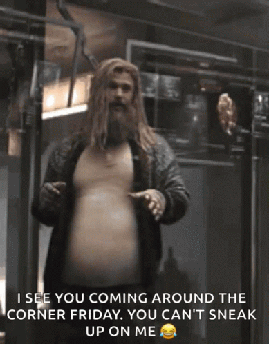 A Man With A Beard Is Standing In A Room And Says " I See You Coming Around The Corner Friday " GIF