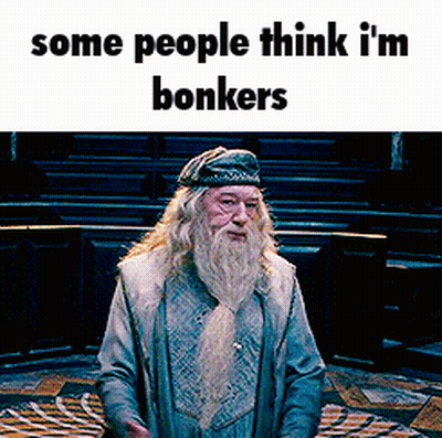 A Man With A Beard Is Standing In A Room With The Words Some People Think I 'M Bonkers On The Bottom GIF